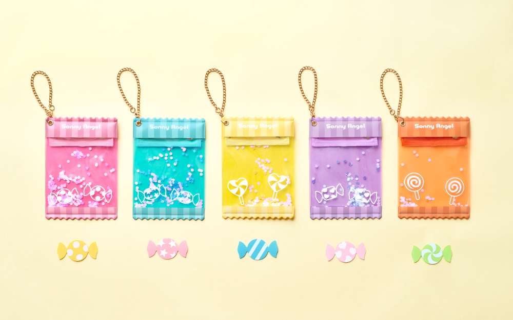 Five colorful Sonny Angel My Bestie Case with candy designs on a yellow background